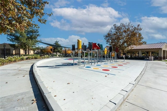 view of street featuring traffic signs, curbs, and sidewalks