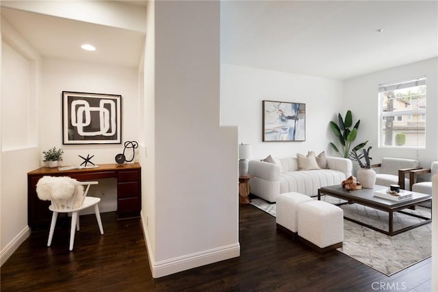 living area featuring recessed lighting, wood finished floors, and baseboards