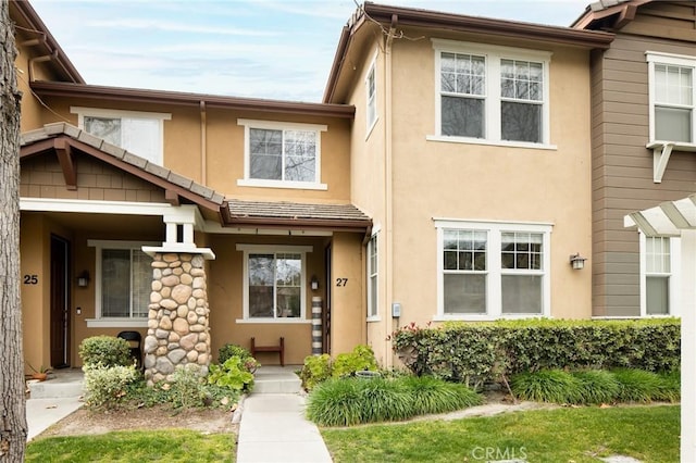 view of front of house featuring stucco siding