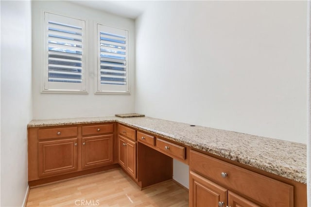 interior details with built in desk and wood finished floors