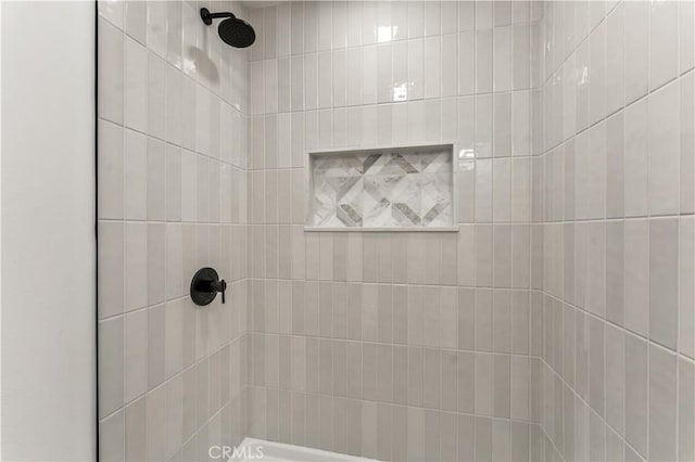 details with a tile shower