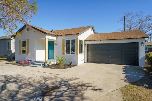 ranch-style home with crawl space, concrete driveway, an attached garage, and stucco siding