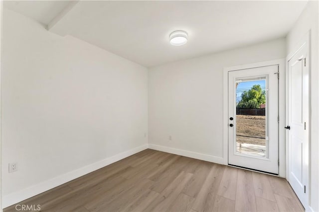 entryway featuring light wood-style flooring and baseboards