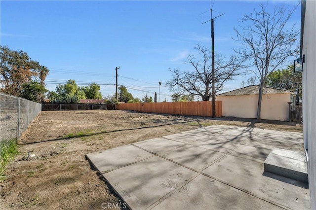 view of yard with a patio and a fenced backyard