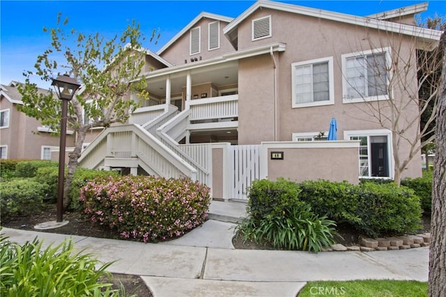 view of property featuring stairway