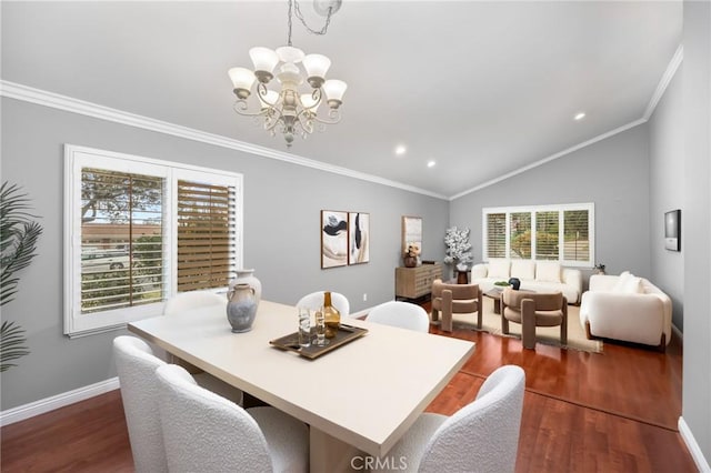 dining area with baseboards, dark wood-style flooring, crown molding, and vaulted ceiling