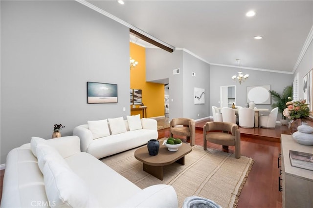 living area featuring lofted ceiling, ornamental molding, wood finished floors, and a chandelier