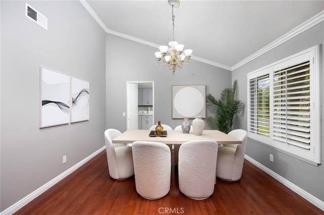 dining area featuring visible vents, baseboards, an inviting chandelier, and wood finished floors