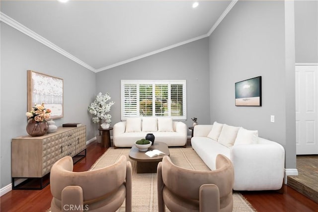 living room featuring lofted ceiling, wood finished floors, and ornamental molding