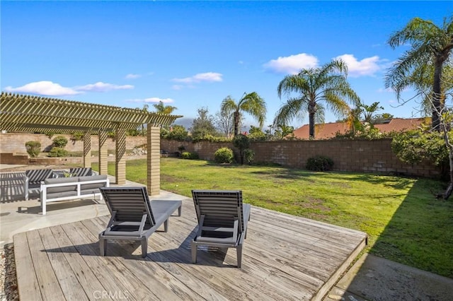 wooden terrace with a lawn, an outdoor hangout area, a pergola, and a fenced backyard