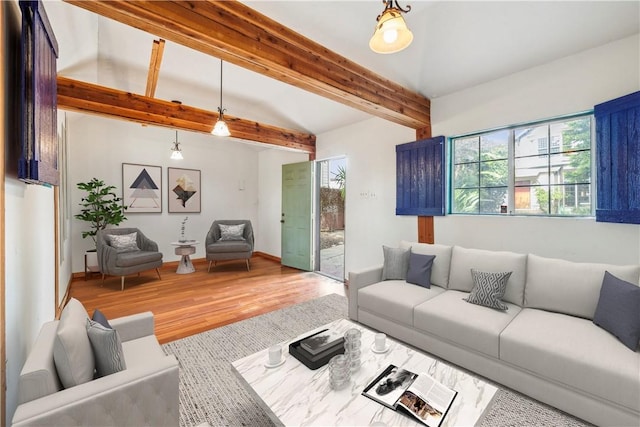 2749 E 17th St, Oakland, CA 94601 - living area featuring healthy amount of natural light, wood finished floors, and beam ceiling