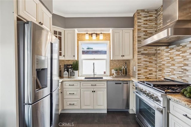 2749 E 17th St, Oakland, CA 94601 - kitchen featuring stainless steel appliances, wall chimney range hood, tasteful backsplash, light stone countertops, and white cabinets