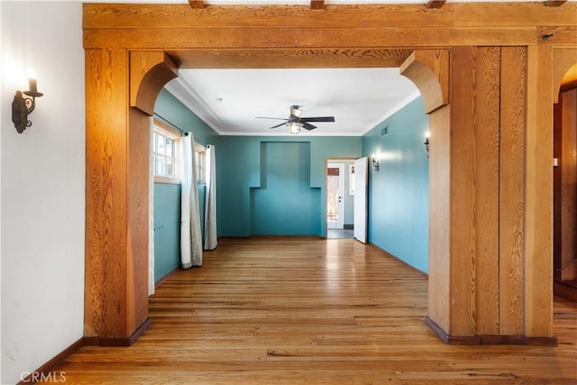 2749 E 17th St, Oakland, CA 94601 - hallway featuring arched walkways, ornamental molding, and light wood finished floors