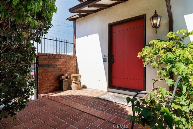 2749 E 17th St, Oakland, CA 94601 - doorway to property featuring stucco siding