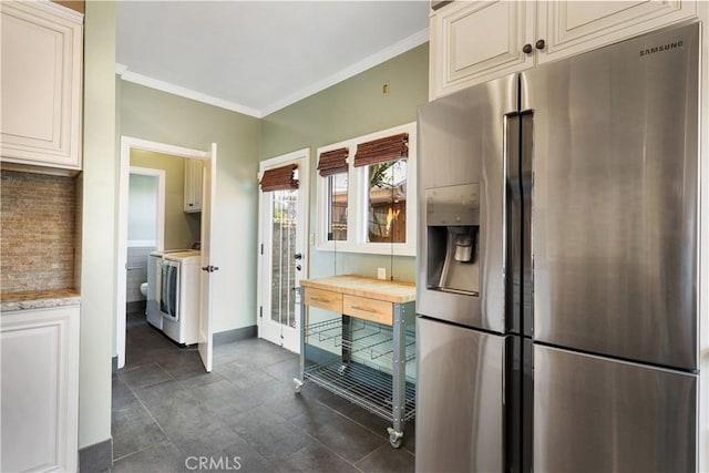2749 E 17th St, Oakland, CA 94601 - kitchen with stainless steel fridge, light countertops, tasteful backsplash, crown molding, and cream cabinetry