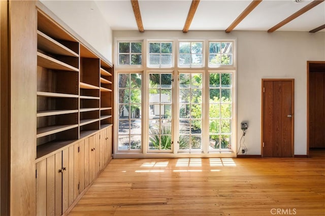 2749 E 17th St, Oakland, CA 94601 - entryway featuring beam ceiling and light wood-style flooring