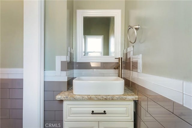 2749 E 17th St, Oakland, CA 94601 - bathroom with vanity and tile walls