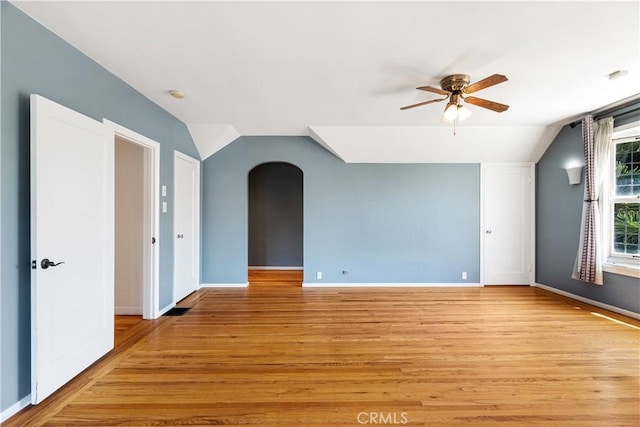 2749 E 17th St, Oakland, CA 94601 - spare room with vaulted ceiling, ceiling fan, arched walkways, light wood-style flooring, and a smoke detector