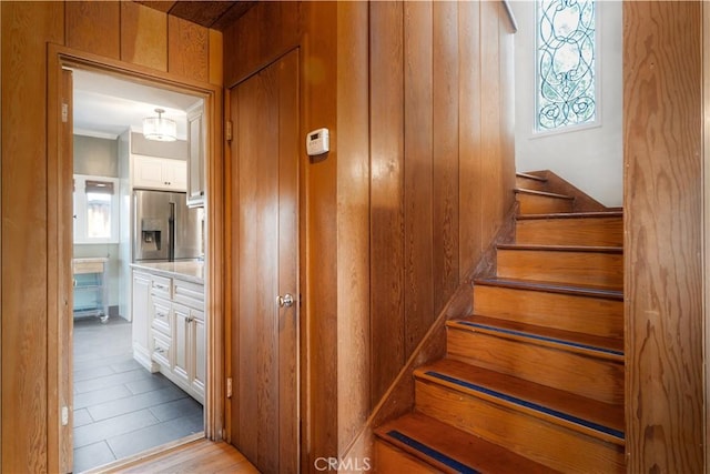 2749 E 17th St, Oakland, CA 94601 - staircase featuring wood walls
