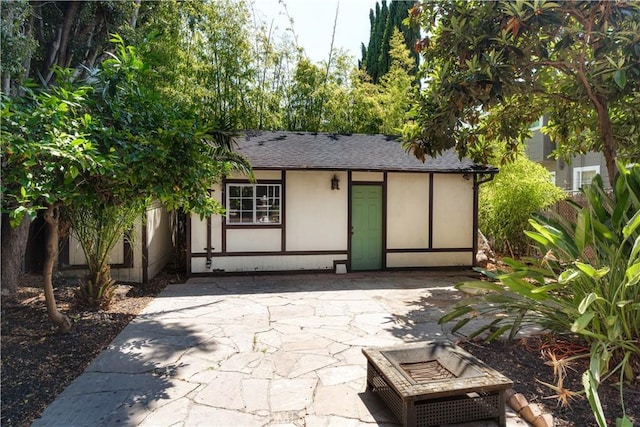 2749 E 17th St, Oakland, CA 94601 - rear view of house featuring a patio area and roof with shingles