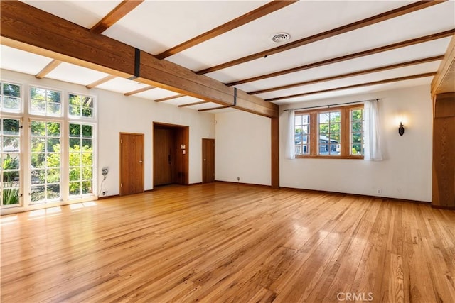 2749 E 17th St, Oakland, CA 94601 - unfurnished living room with beam ceiling and light wood-style floors