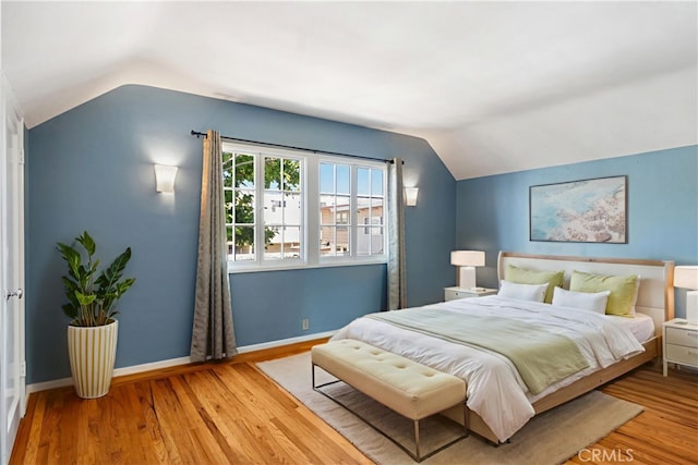 2749 E 17th St, Oakland, CA 94601 - bedroom featuring vaulted ceiling and wood finished floors