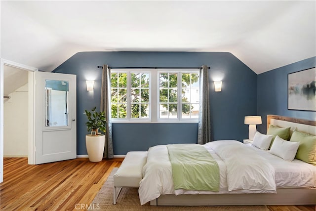 2749 E 17th St, Oakland, CA 94601 - bedroom with vaulted ceiling and light wood finished floors