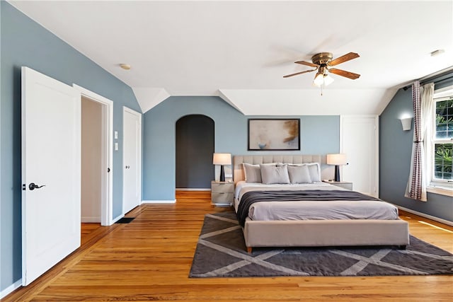 2749 E 17th St, Oakland, CA 94601 - bedroom with vaulted ceiling, arched walkways, wood finished floors, and ceiling fan