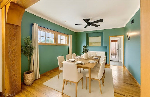 2749 E 17th St, Oakland, CA 94601 - dining area featuring ornamental molding, light wood-style floors, and ceiling fan