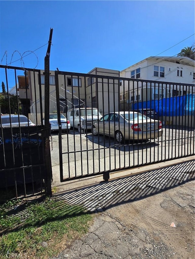 view of gate featuring a residential view