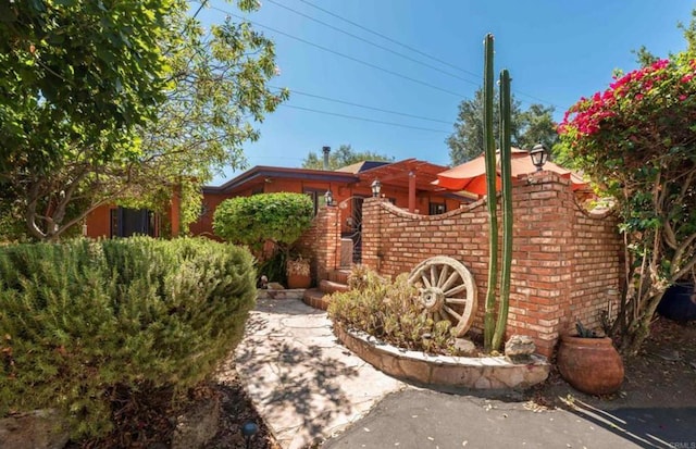 exterior space featuring brick siding