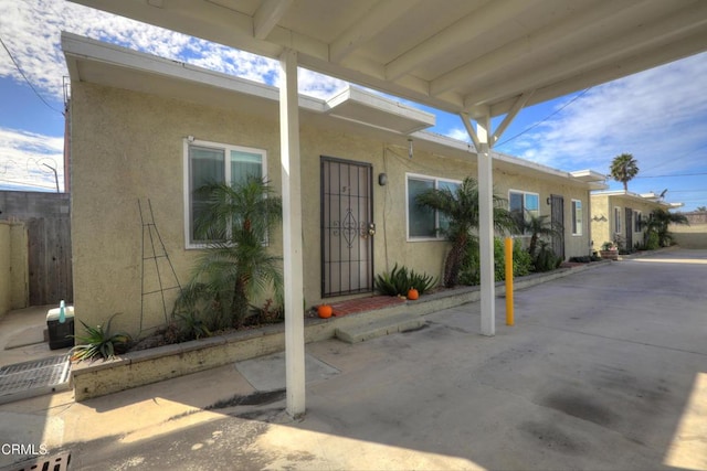 property entrance featuring stucco siding