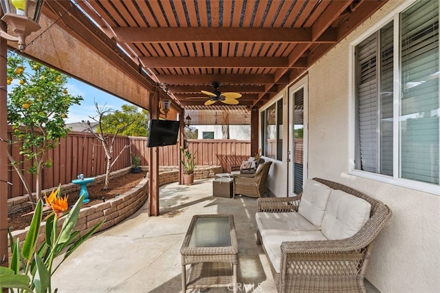 view of patio featuring outdoor lounge area, a fenced backyard, and ceiling fan