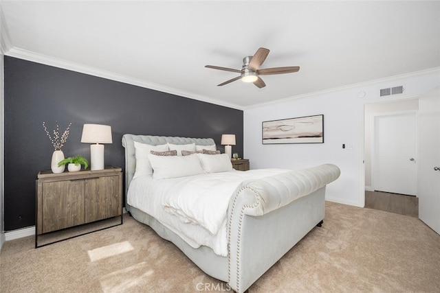 bedroom with light colored carpet, visible vents, ornamental molding, and baseboards