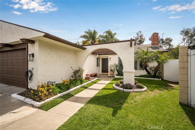 3560 Wisteria St, Seal Beach, CA 90740 - view of front of property featuring stucco siding, an attached garage, and driveway