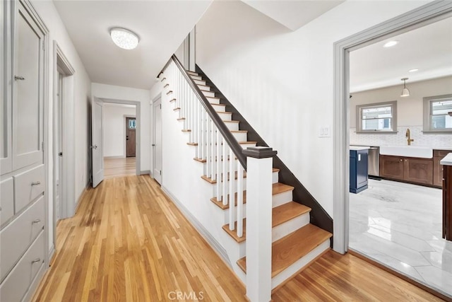 stairway with wood finished floors