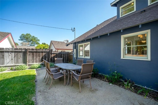 view of patio / terrace featuring outdoor dining area and fence