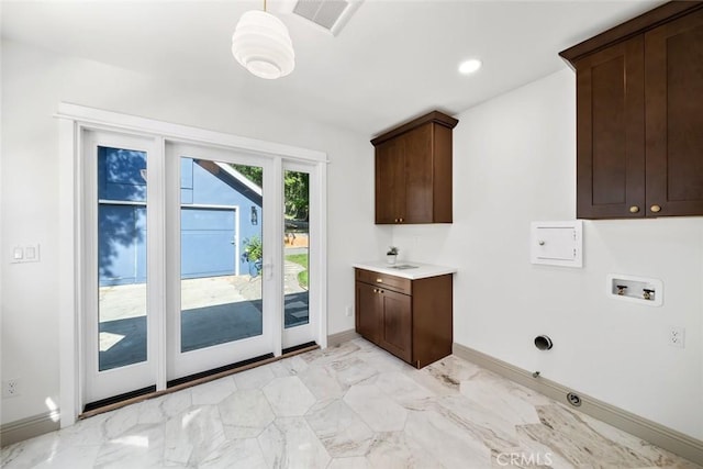 laundry area featuring visible vents, marble finish floor, washer hookup, cabinet space, and baseboards