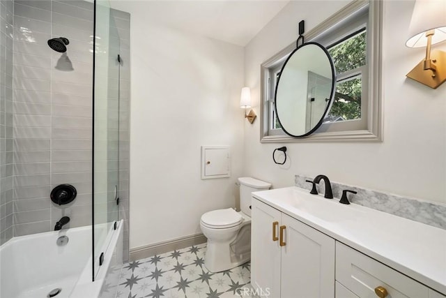 full bathroom with vanity, washtub / shower combination, baseboards, tile patterned floors, and toilet