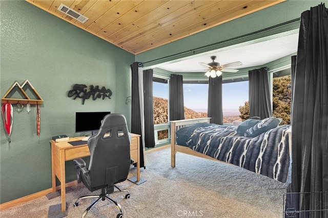 bedroom featuring carpet floors, visible vents, a textured wall, wooden ceiling, and baseboards