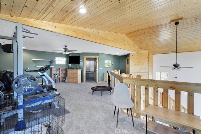 interior space with lofted ceiling, wood ceiling, ceiling fan, and carpet flooring