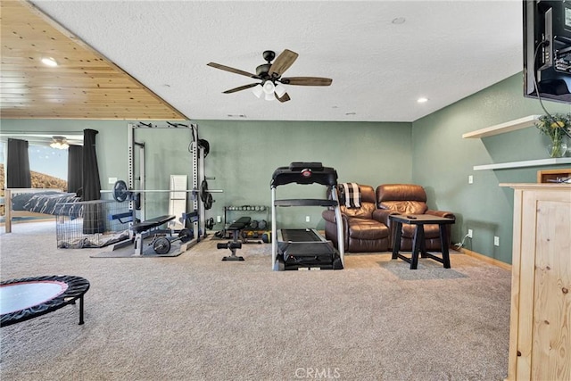 exercise room with baseboards, a ceiling fan, carpet, a textured ceiling, and recessed lighting