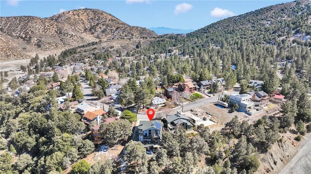 drone / aerial view featuring a residential view and a mountain view