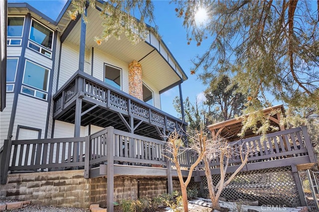 view of home's exterior featuring a deck