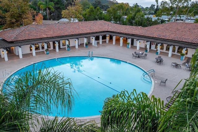 pool with a patio area