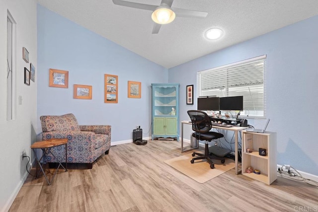 office area with baseboards, lofted ceiling, a textured ceiling, and wood finished floors