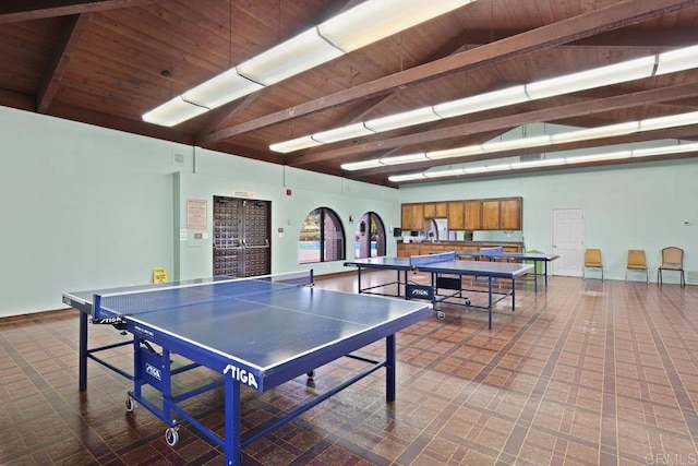 playroom featuring lofted ceiling with beams and wood ceiling