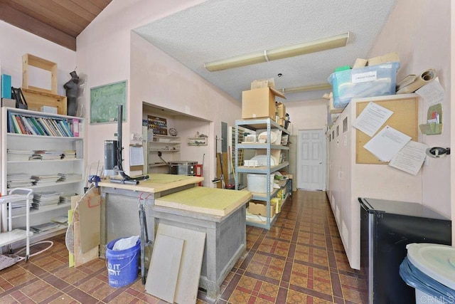 kitchen with a textured ceiling and light countertops