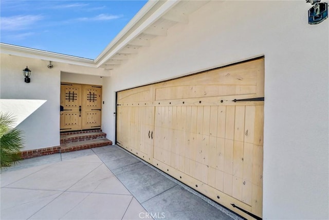 doorway to property with stucco siding