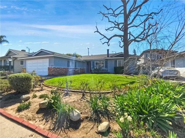 ranch-style home with a garage, a front yard, and brick siding